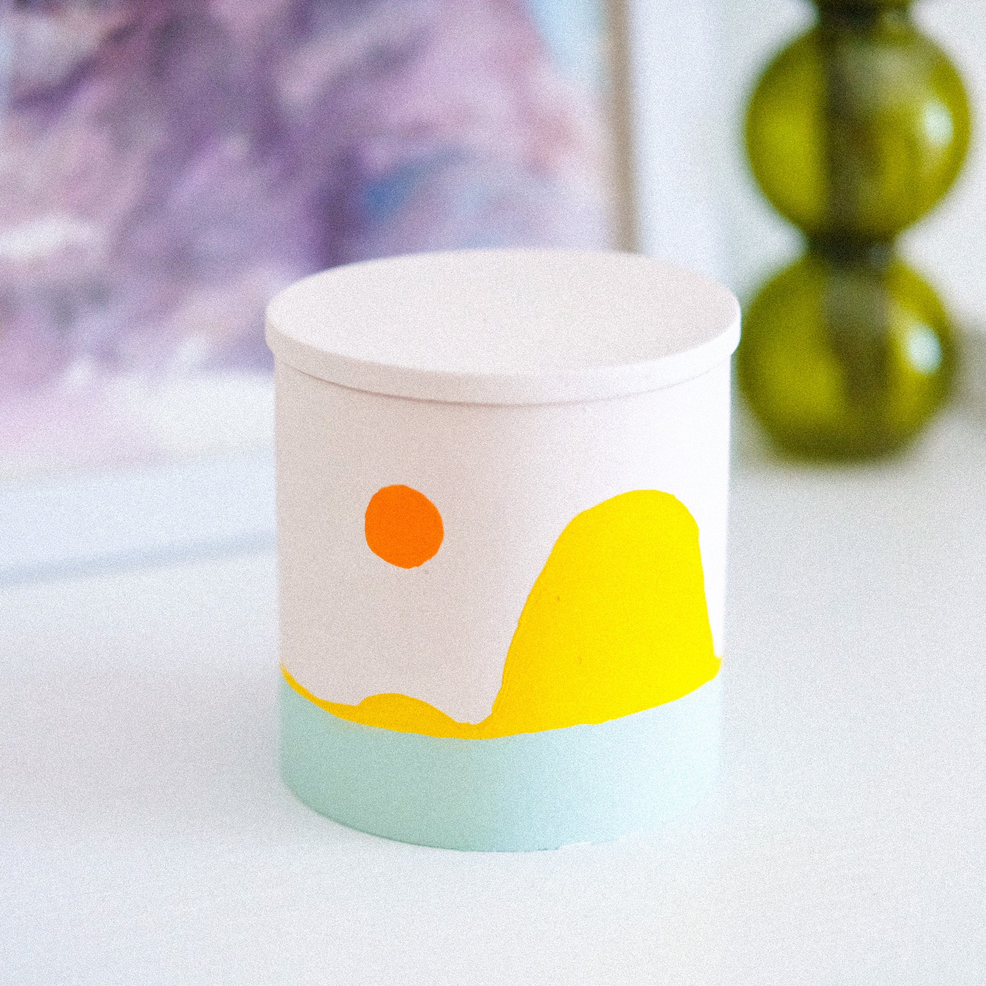 sunset scented soy candle infused with peony & blush suede natural oils